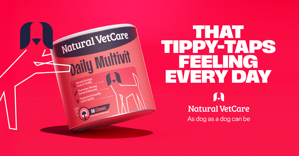 A white bottle of Natural VetCare Daily Multivit for dogs featuring a green and blue label with a dog illustration.